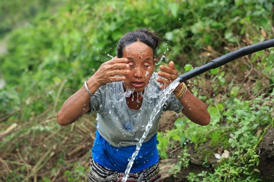 Gaumati Rana washing up at a water source