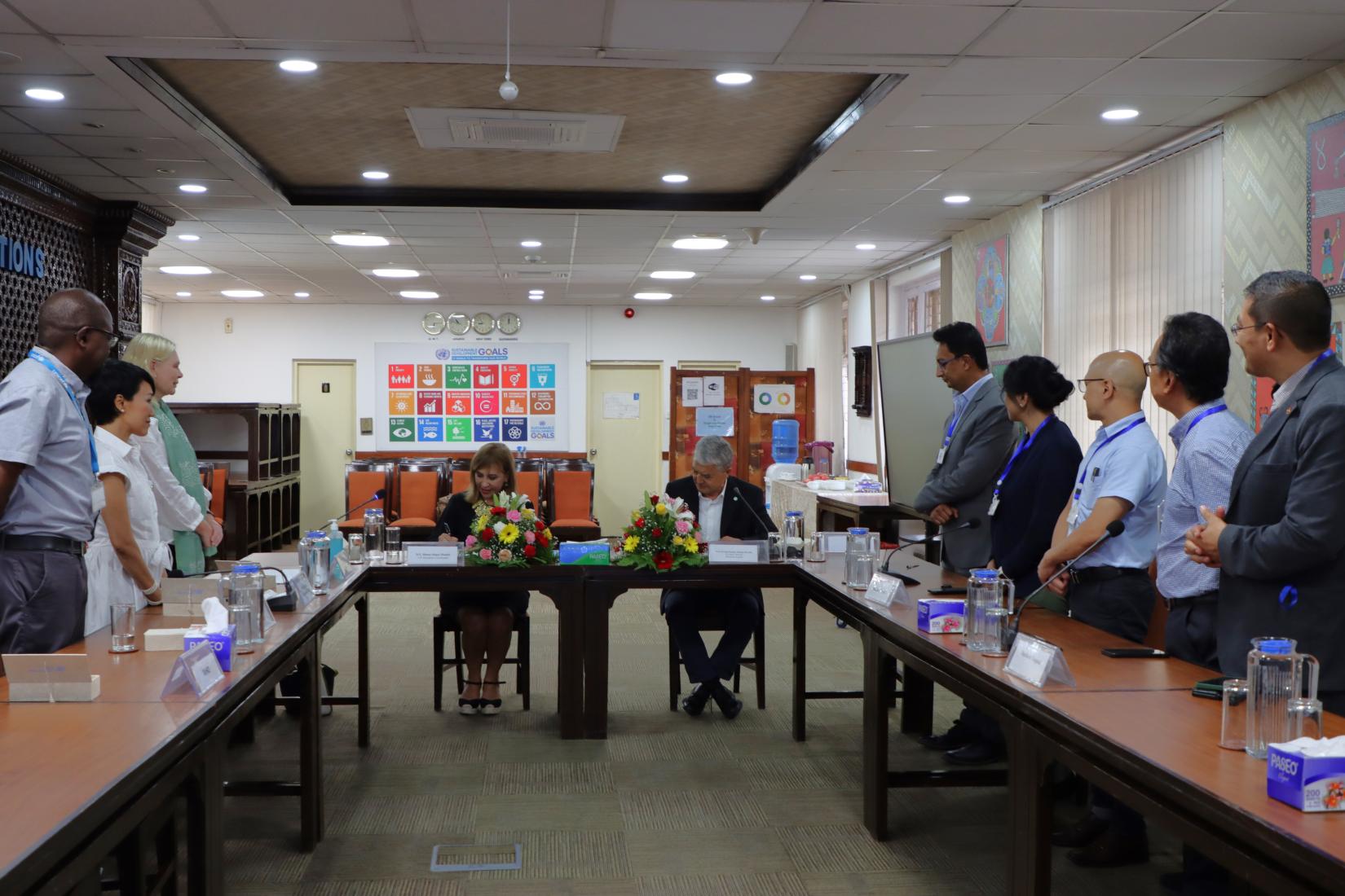 The UNRC Madam Hanaa Singer Hamdy and the  Executive Director of Dhulikhel Hospital Prof  Dr. Ram Kantha Makaju Shrestha formalizing the collaboration