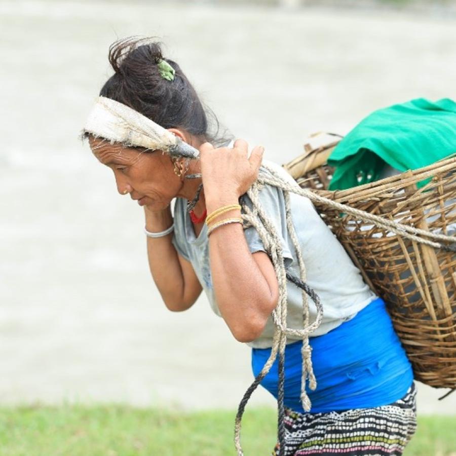 Gaumati Rana fetching water for her household in Tallo Rimna, Jajarkot District.