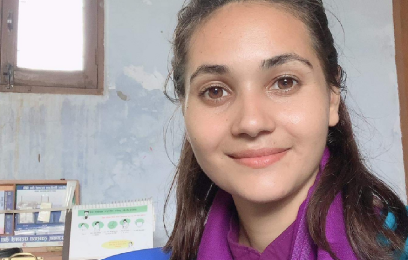 A headshot of the service provider with brown hair and brown eyes looking in front of the camera and smiling.