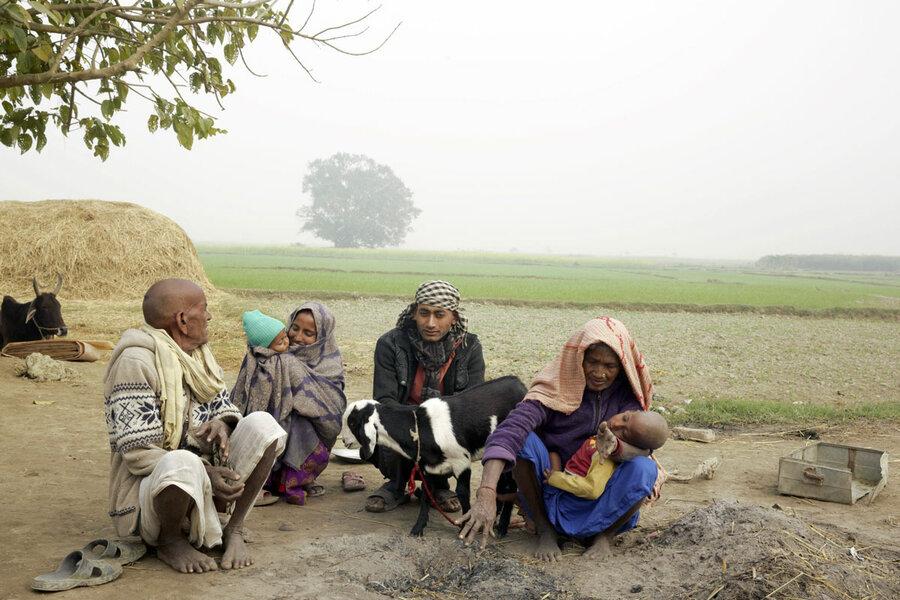 'The water was waist-high': Putta Lal Mahout with his parents, wife and two sons.