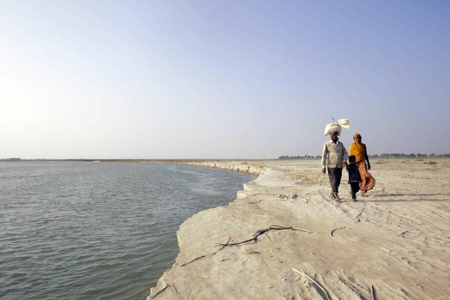 Locals travel by boat to a bordering Indian town to buy supplies at cheaper prices.