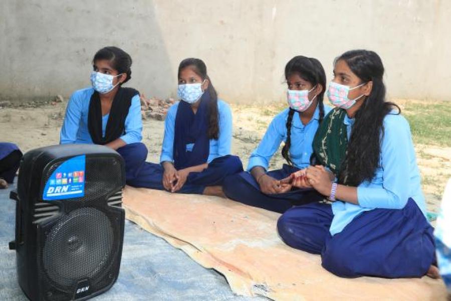 Sakila Khatun (far right), 13, speaks up during a discussion with her peers related the latest episode of the Rupantaran radio show.