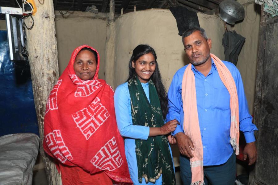 Sakila Khatun (centre), with her mother Fatima (left) and father Nazir (right) at their home in Parsa District in southern Nepal