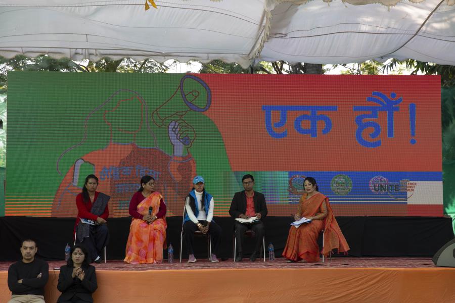 In this photo there are speakers taking part in the panel discussion calling for greater action & resources to be committed to end the scourge of GBV in Nepal