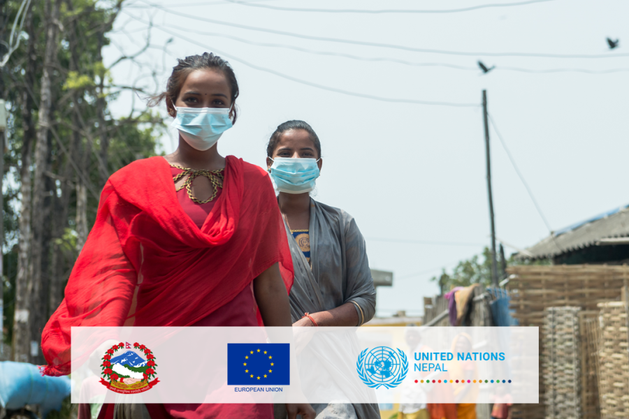 Two girls are walking on the street wearing masks