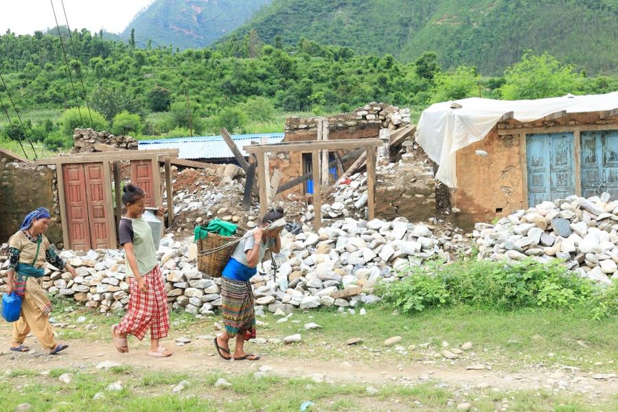 Women from Tallo Rimna in Jajarkot District carrying water to their homes