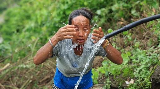 Gaumati Rana washing up at a water source