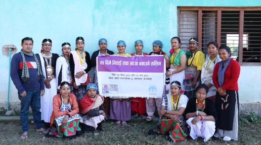 A group of people, some standing and some sitting, holding a rectangular banner that reads "45 Days Sweets and Lunch Making Training."