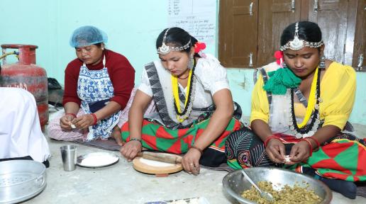 A group of people, some standing and some sitting,